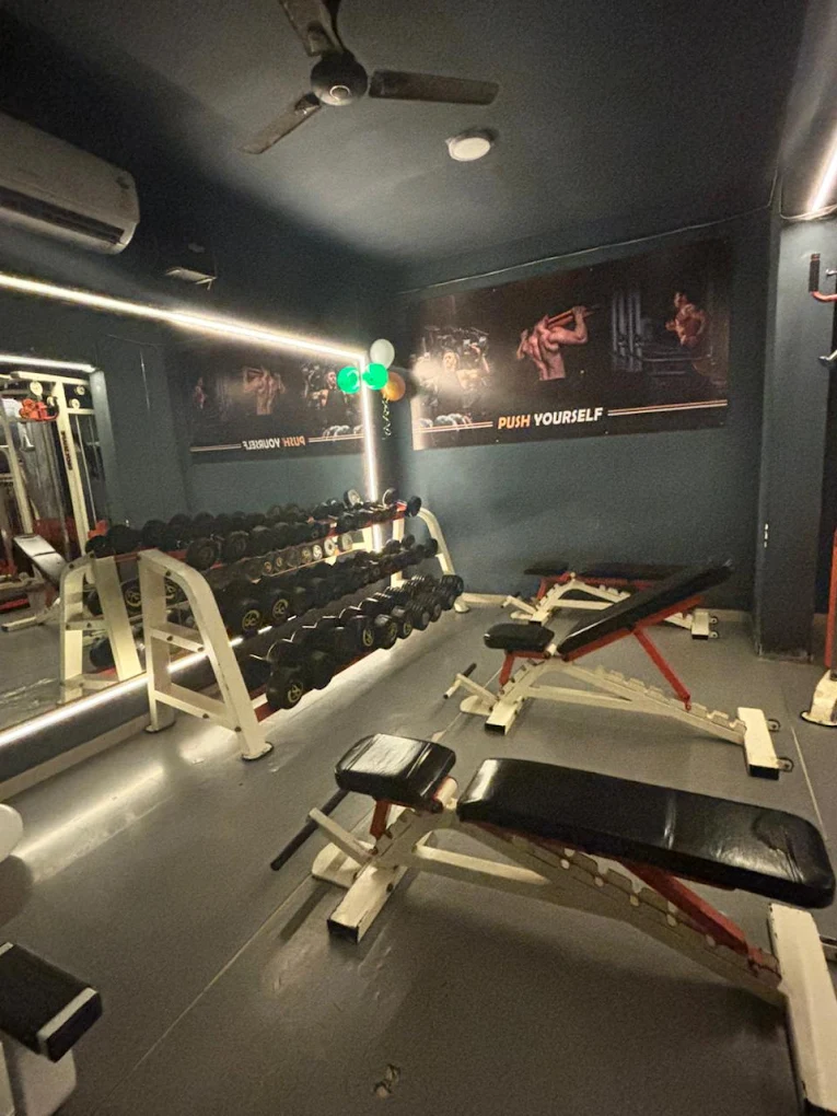 Strength training area with benches and dumbbells